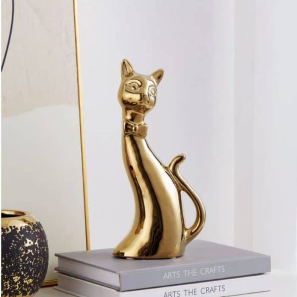 Objet décoratif à pose chat stylisé en céramique or 25x8x12 cm